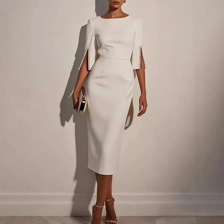 Robe élégante mi-longue à manches fendues ornées de perles